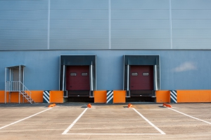 Cargo doors at big industrial warehouse building